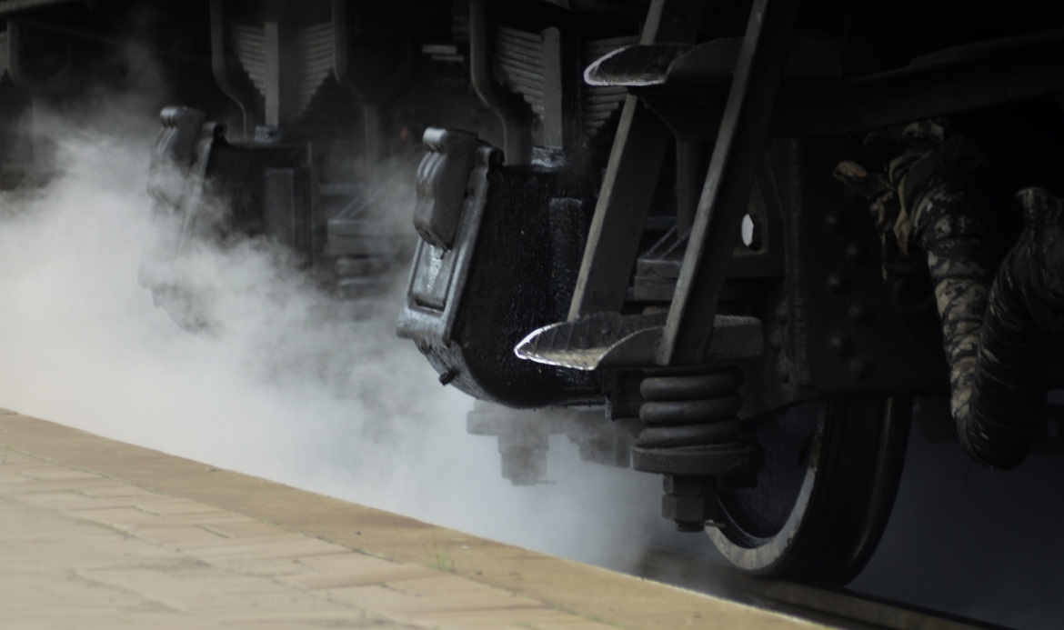 Black wheels of an old USSR locomotive. Vintage wheels of an old soviet freight railcar