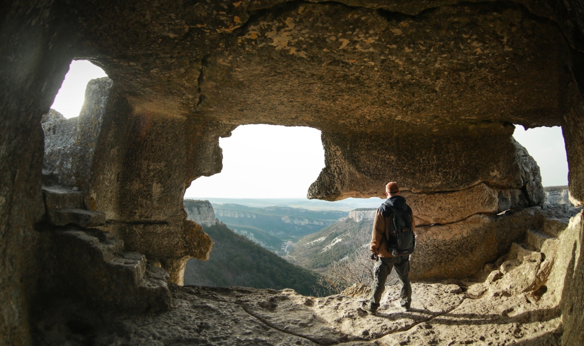 Man stands in high cave