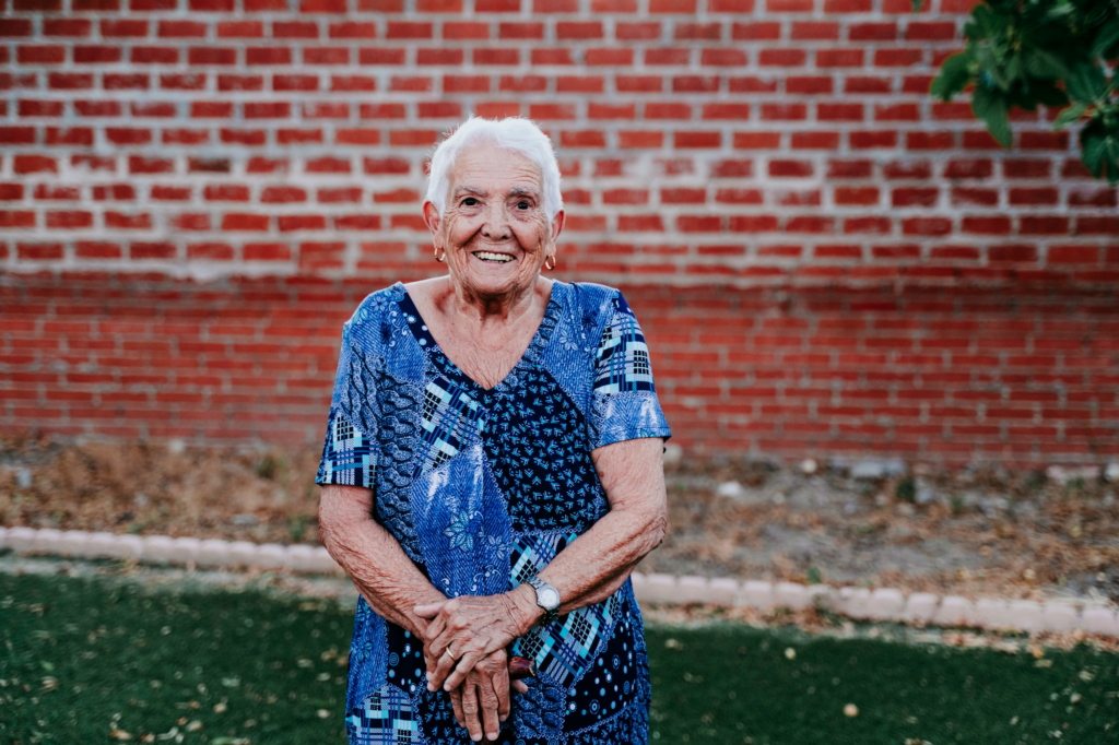 portrait of old lady in her 80s smiling happily