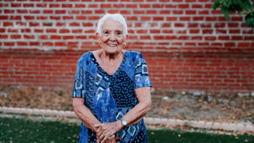 portrait of old lady in her 80s smiling happily