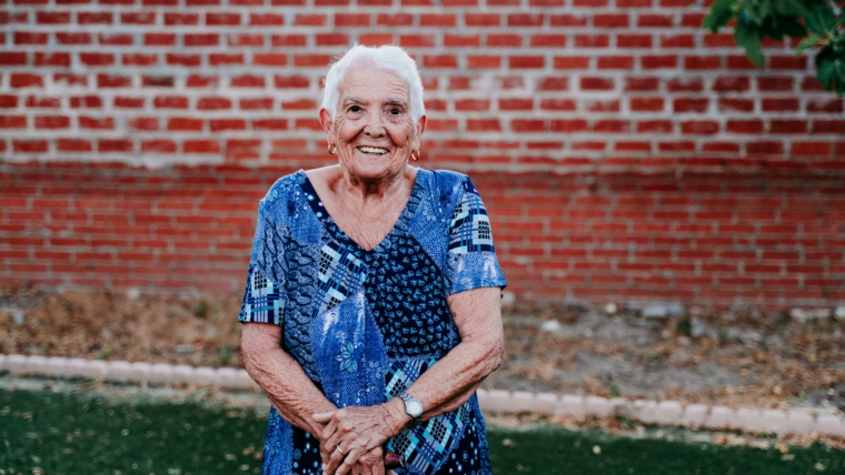 portrait of old lady in her 80s smiling happily